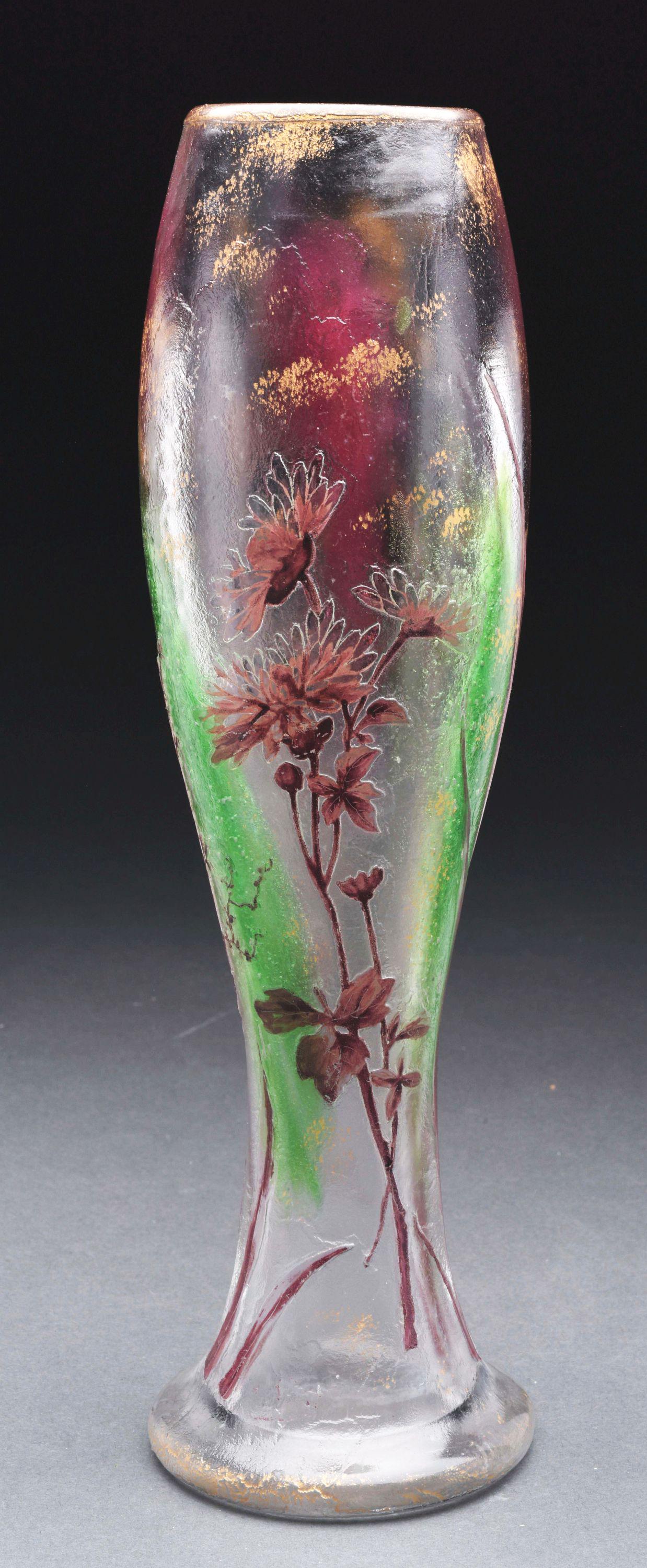 CAMEO AND ENAMELED VASE AFTER GALLE.: Cameo vase in the manner of Galle has cameo floral design on front and back. The cameo flowers, stems and leaves are enameled in shades of purple and the decoration is set against a clear internally d