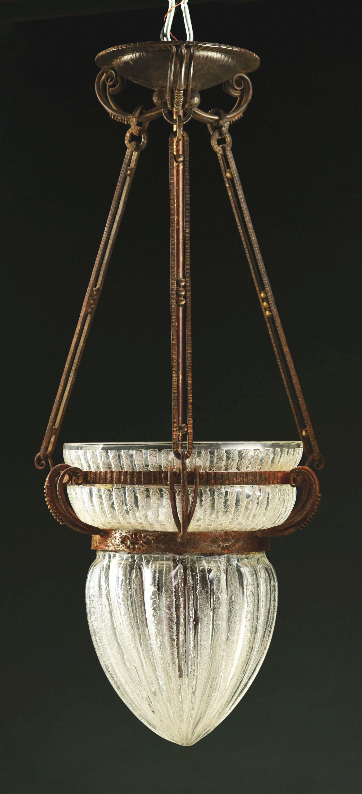 DAUM NANCY HALL LIGHT CHANDELIER.: An Art Deco etched and carved glass and wrought iron chandelier by Daum decorated with an acid-etched and carved oversized shade set with in its original wrought iron hardware. The shade is signed “