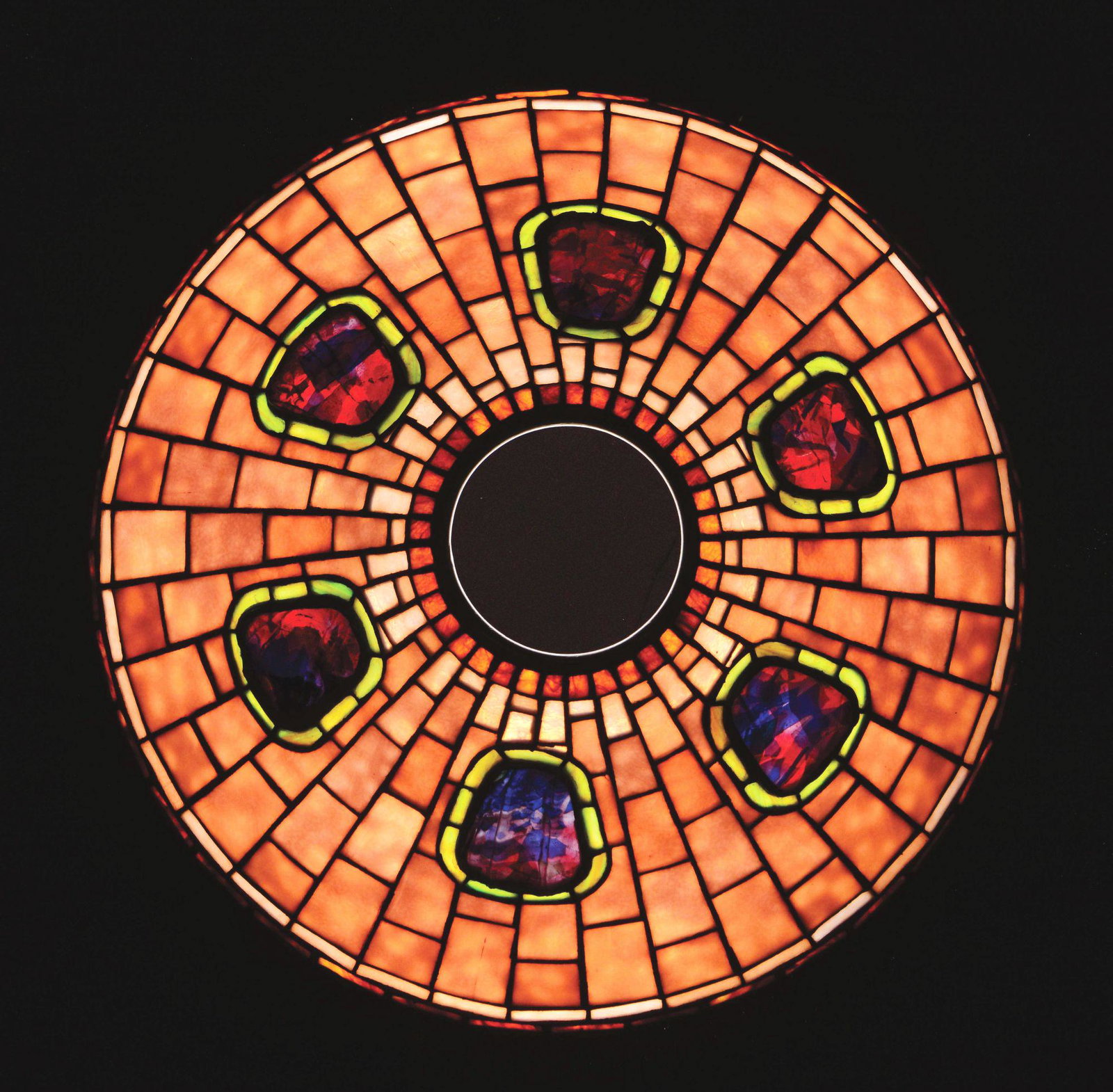 CONTEMPORARY MISSION STYLE LEADED GLASS SHADE.: Contemporary leaded glass shade by Porcelli Studios is done in the mission style with a geometric field of light lavender glass. The shade is further decorated with six medallions of confetti glass pl