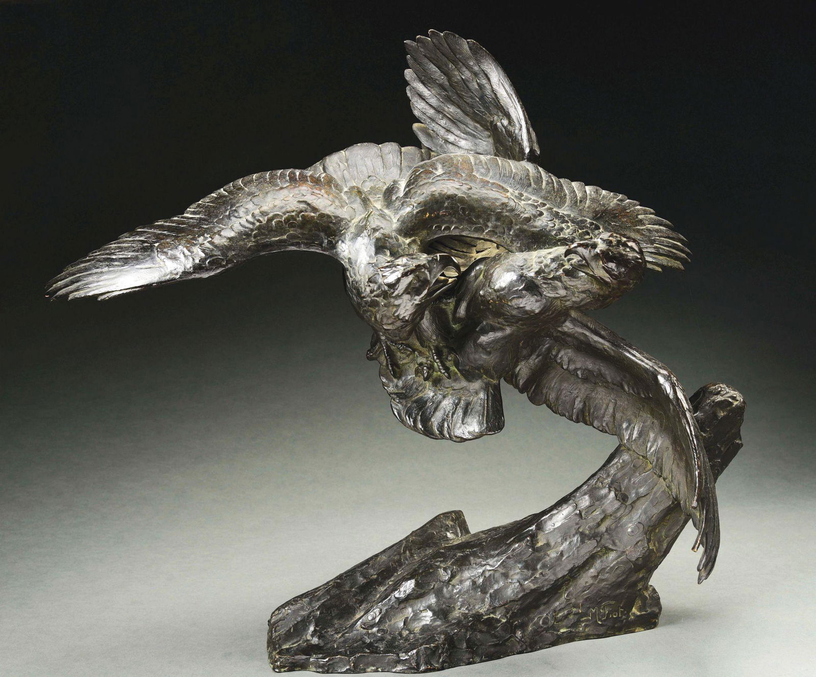 MAXIMILIEN LOUIS FIOT (FRENCH, 1886 - 1953) COMBAT: A bronze sculpture of combatant eagles in flight above an outcropping. Incised signature on base "M. FIOT". Foundry mark "SUSSE FRERES PARIS". Size: 28" T. x 33" L. overall. Condition: Very good with