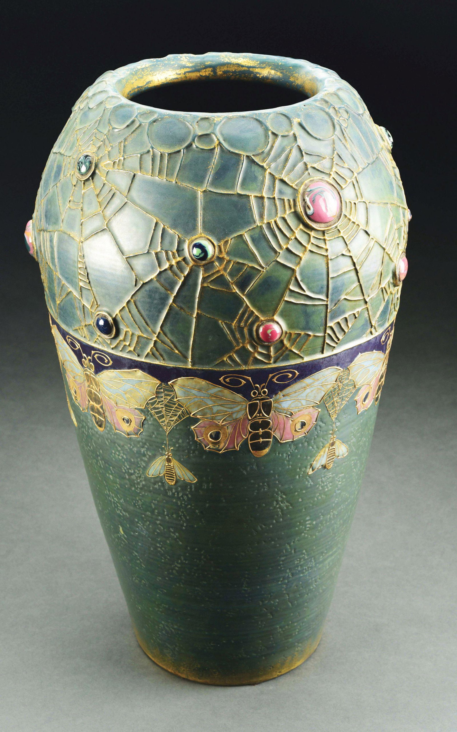 AMPHORA MONUMENTAL BUTTERFLY AND WEB VASE.: A Rare Monumental “Gres Bijou” example. Applied enameled butterflies, insects, and webs with inset jewels and iridized glazes. Amphora Oval mark, impressed 3728-D RSTK mark. 18 - 3/4" high. This v