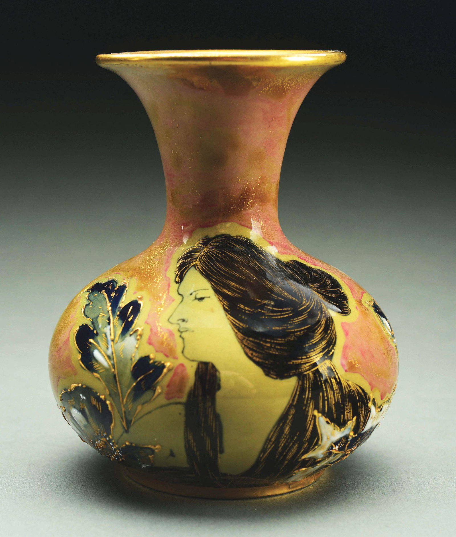 AMPHORA PORTRAIT VASE.: An early example of a portrait vase on an ivory porcelain body with green brown and blue high fired glazes. RSTK mark, impressed “474-12”. 6 1/4“ high. A similar model illustrated in The House o