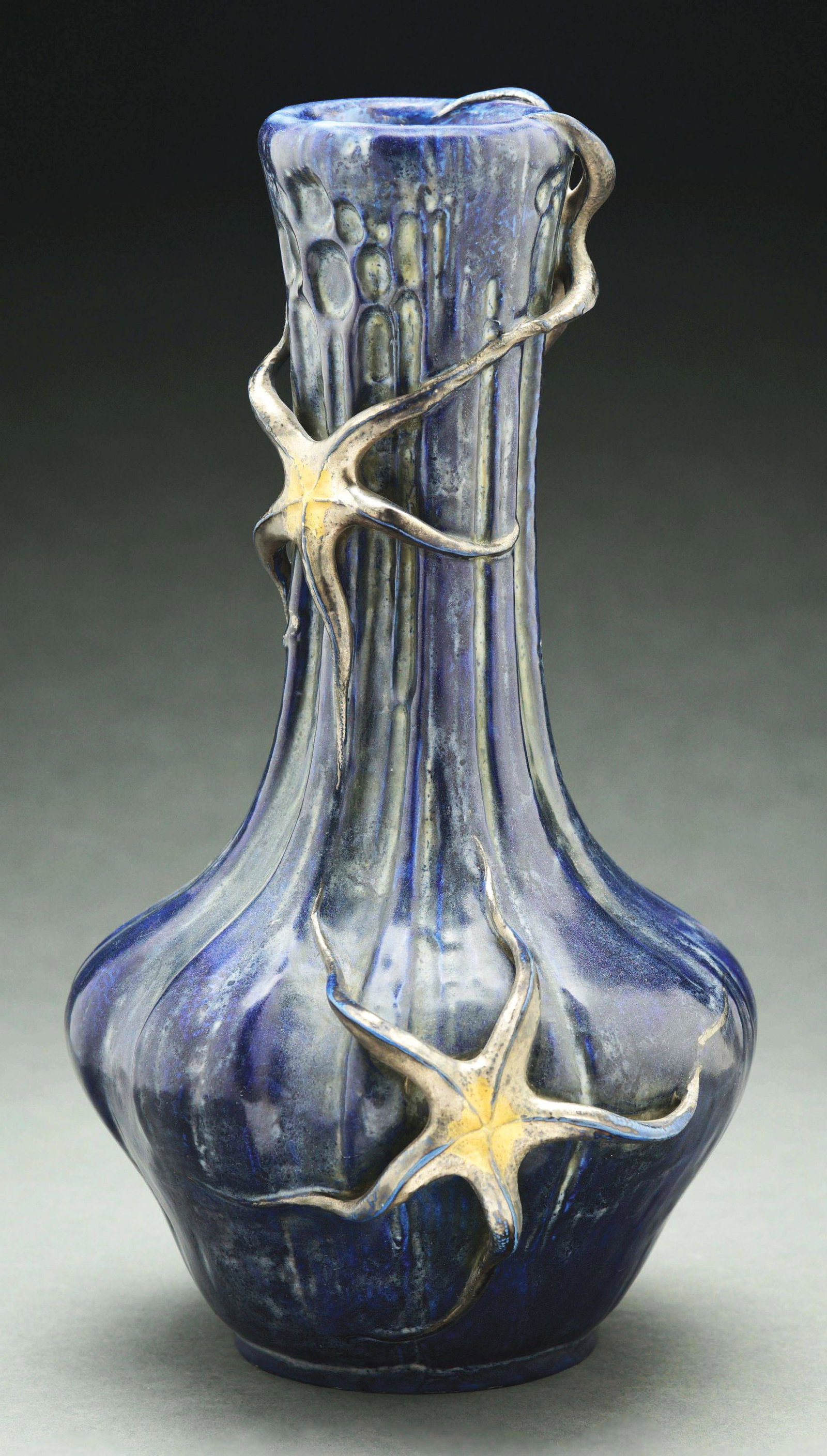 AMPHORA STARFISH VASE.: Paul Daschel designed with four applied starfish in motion. Cobalt blue and gold glazes. Amphora Oval mark. Impressed "3640" (marks partially obscured from glaze). 15 - 1/4" high. A similar model Illu
