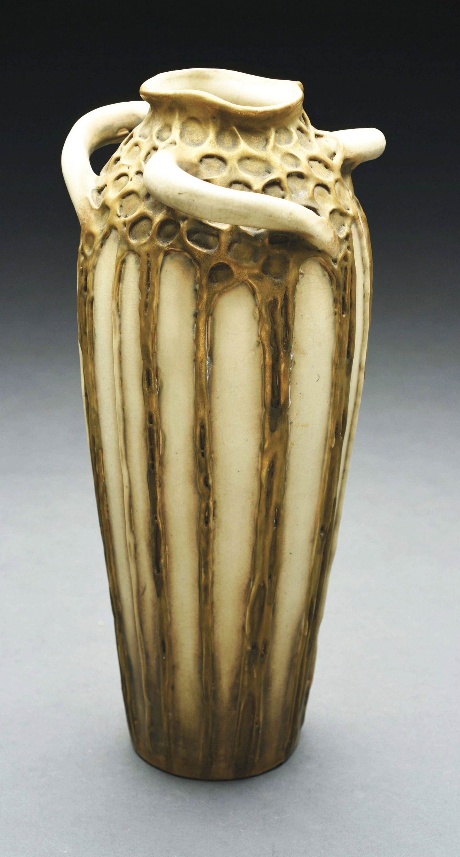 AMPHORA ORGANIC VASE WITH FOUR HANDLES.: Applied decoration and four handles at the neck. Cream and gold glazes. RSTK monogram, Amphora Austria mark, impressed numbers "886-62". 12 - 7/8" high. Illustrated in "The House of Amphora", Scott, p