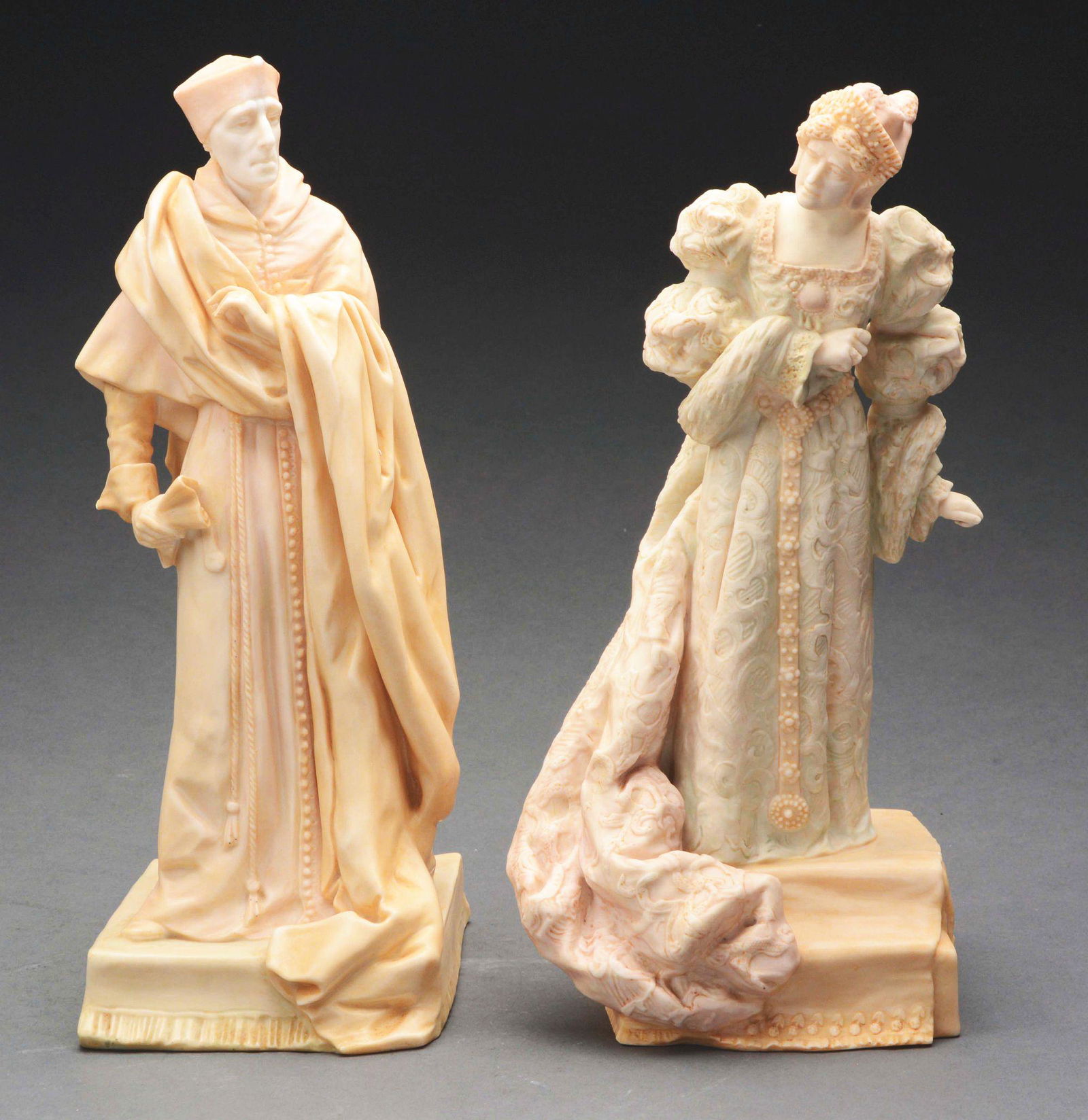 LOT OF 2: ROYAL DOULTON FIGURINES.: Two Royal Doulton figurines depict a man and a woman. The man is believed to be modeled after Cardinal Wolsey and is wearing a long robe and hat with a roll of paper in his hand. The figurine is white