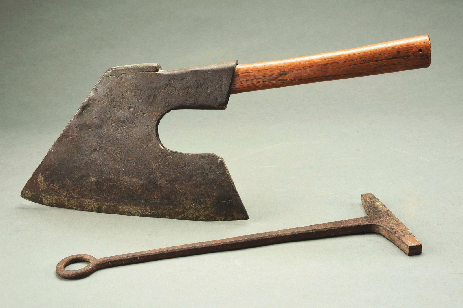 LOT OF 2: EARLY IRON PIECES.: Lot consists of a branding iron by D. Whittenmore, 16 - 1/2" long, and an early axe signed "_", c. 1850, 13" long blade and 10" long handle. Both in excellent condition. Condition: (Excellent). Dimens
