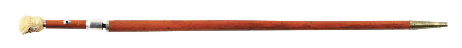 AN EARLY 19TH CENTURY SWORD WALKING STICK CANE WITH: c. 1810. The handle is 2 - 1/8" high and 1 - 5/8" in diameter. A scalloped shell decoration is carved on the top. There is a 1/4" thin silver collar, silver eyelets and silver mounts where the sword w