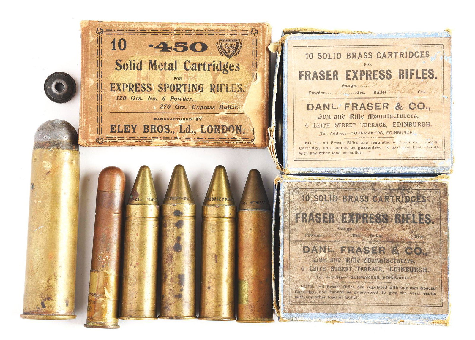 LOT OF 9 AMMUNITION/SHELLS.: Two boxes of "10 SOLID BRASS CARTRIDGES / FOR / FRASER EXPRESS RIFLES". One empty box of "10 .45 / SOLID METAL CARTRIDGES / FOR / EXPRESS SPORTING RIFLES. One cartridge with a measurement of 4 3/8" X 