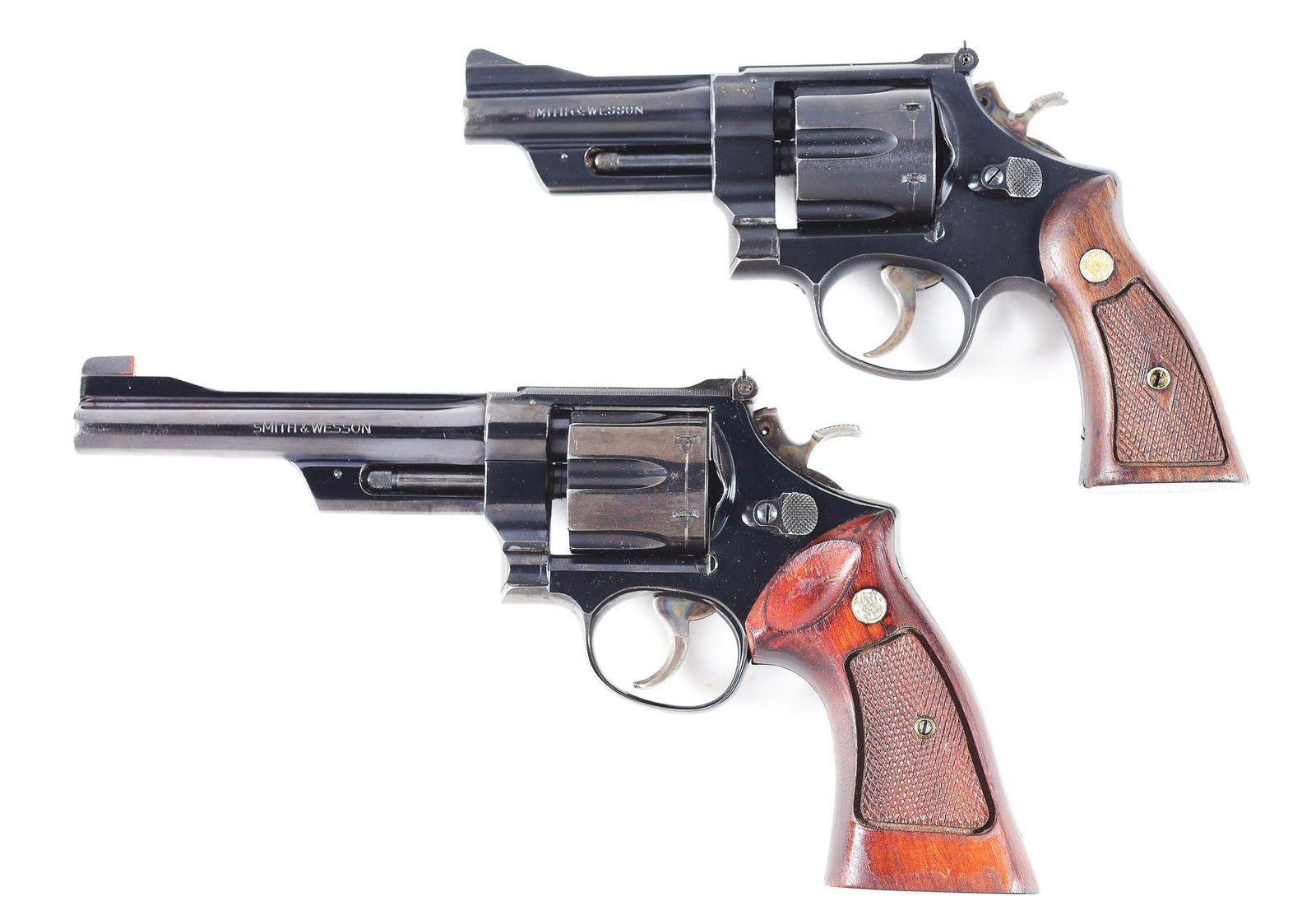(C+M) LOT OF 2: SMITH & WESSON MODEL 28 HIGHWAY: Lot consists of (A) Manufactured 1959/60. Smith & Wesson Model 28 Highway Patrolman. N-Frame, six shot, .357 magnum with 4" barrel. Adjustable rear sight with two piece diamond checkered factory grips