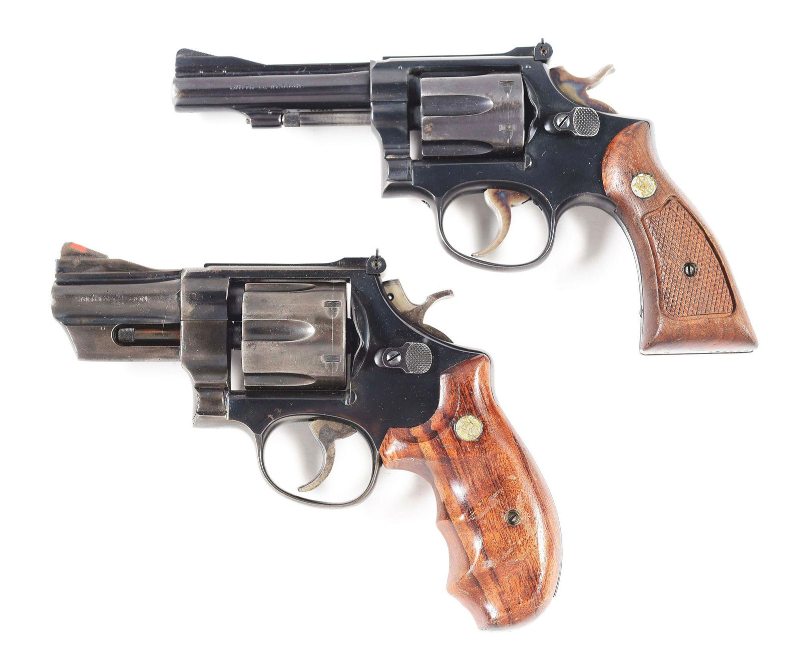 (C+M) LOT OF 2: SMITH & WESSON MODEL 18 AND MODEL 24-3: A) S&W Model 18, K-22 Combat Masterpiece. 4-inch barrel with pinned high ramp front sight and square notch adjustable rear sight. Chambered in .22LR. 5-screw frame. 2-piece checkered walnut, square bu