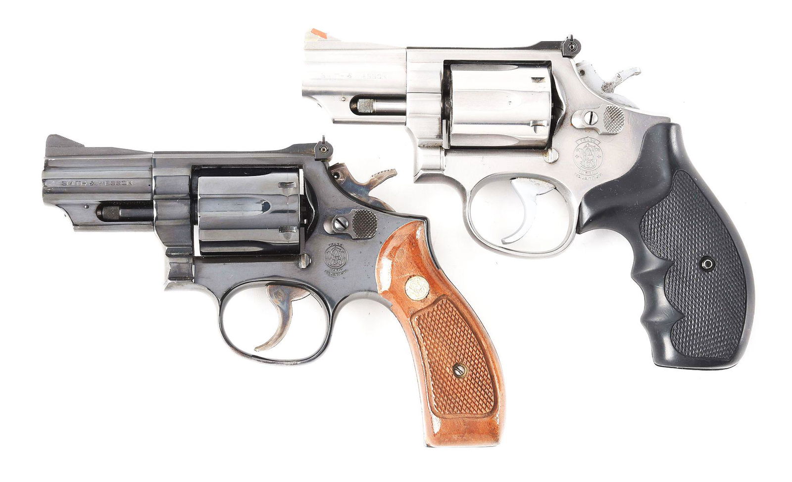 (M) LOT OF 2: SMITH AND WESSON 66-2 AND 19-5 REVOLVERS.: Lot consists of (A) Smith & Wesson Model 66-2 stainless steel, with 2-1/2" barrel chambered in .357 Magnum. Red ramp front and adjustable square notch rear sights. Black rubber wraparound grips. CONDI