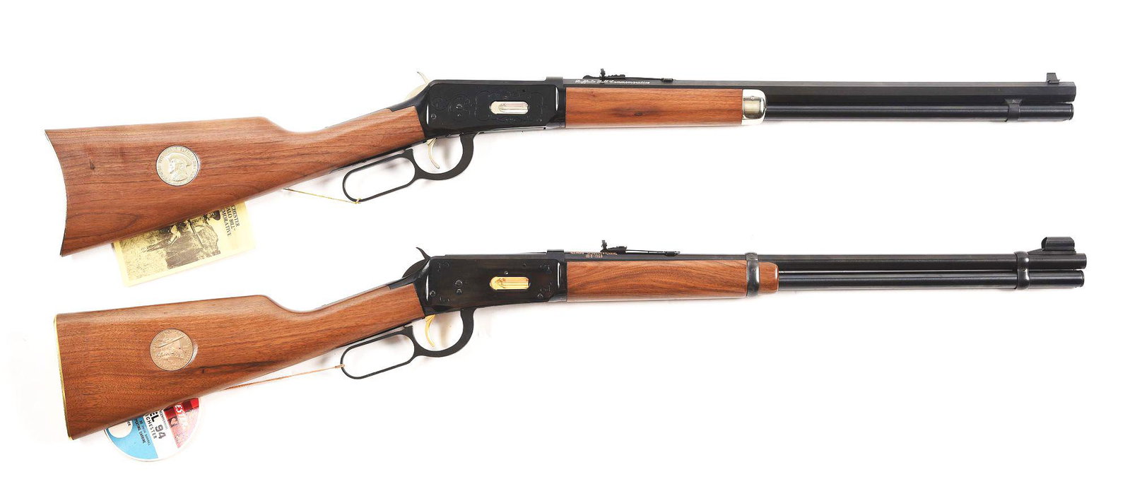 (M) LOT OF 2: WINCHESTER 94 BUFFALO BILL AND ILLINOIS: Lot consists of (A) Winchester Model 94 Buffalo Bill Commemorative rifle. 20" octagon barrel with a full length magazine tube, chambered in .30-30 Win. Plain straight grain walnut stock and forearm. R
