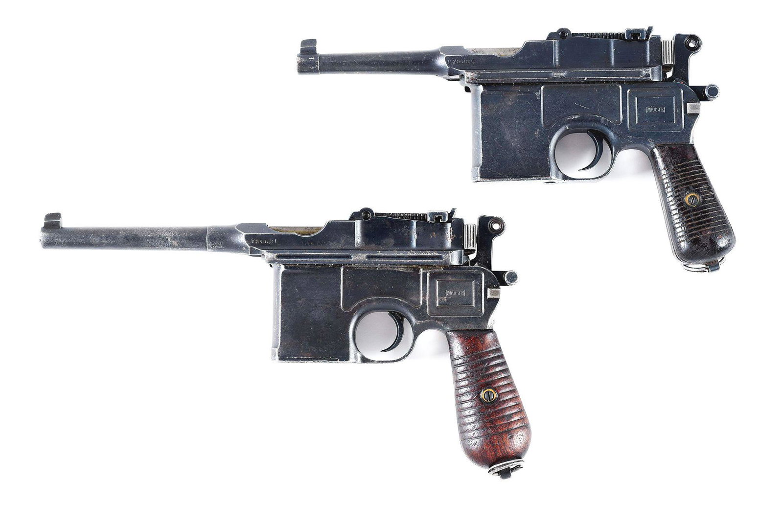 (C) LOT OF TWO BROOMHANDLE MAUSER C96 SEMI AUTOMATIC: Gun (A) is what is referred to as a "Bolo" model. The numbers on the upper part of the gun are matching, the numbers on the lower part of the gun are matching. Of interest, there is what appears to be