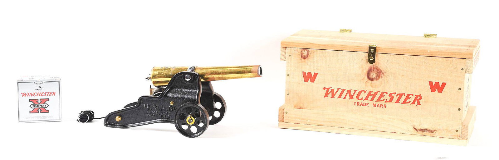 WINCHESTER BREECH LOADING SIGNAL CANNON.: In the 1970's the Bellmore Johnson Company obtained the rights to produce the cannon for the Winchester Corperation. Brass plated steel barrel with cast wheels and carriage. CONDITION: Gun has been fi