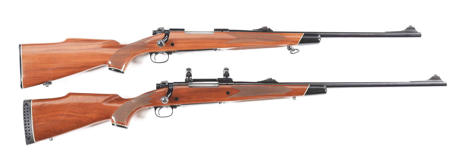 (M) LOT OF 2: WINCHESTER 70 XTR BOLT ACTION RIFLES.: Post 64 production model 70 Winchester chambered for .243 Winchester with a 22 inch barrel. Fitted with a checkered walnut Monte Carlo stock Open sights and factory drilled and tapped. CONDITION. As n