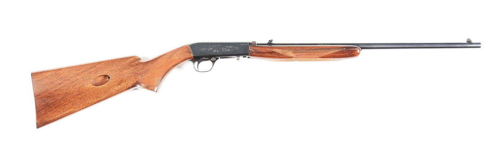 (M) BROWNING SEMI-AUTOMATIC .22 LR RIFLE.: Standard grade, Belgian made, Browning semi-automatic rifle. 19" round barrel chambered in .22 long rifle. Blue finish with two piece checkered walnut stock and forearm. CONDITION: Like new in origina