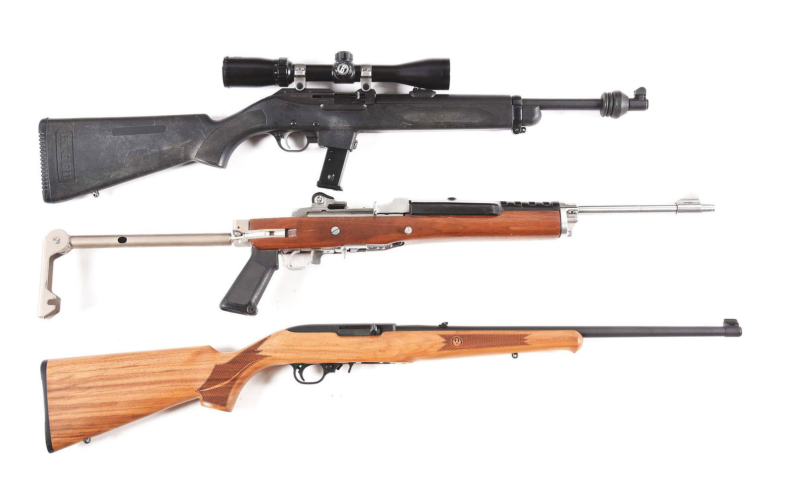 (M) LOT OF 3: RUGER POLICE CARBINE, MINI 14, AND 10/22: Lot consists of: (A) Ruger Police Carbine semi-automatic rifle with scope. Made 2002. Round steel barrel with blade front sight and u-notch rear. Blued finish. Factory polymer stock. a previous owner 