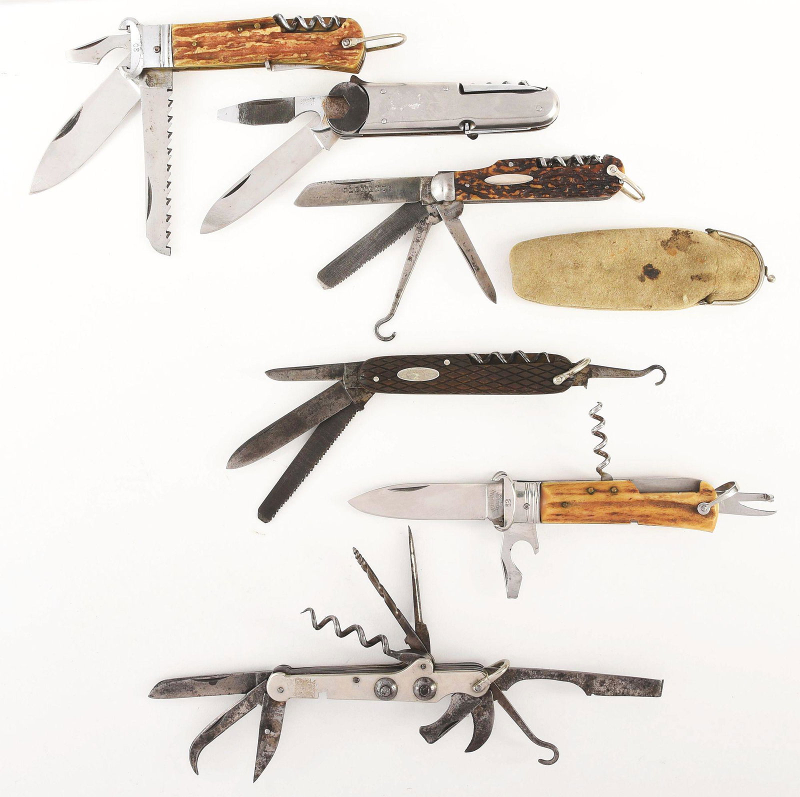 LOT OF 6: FOREIGN MULTI BLADE SPORTMAN BY AUSTIN: (A) TONLRINI INOX SCARPERIA. 4 - 3/4" five blade stag handled sportsman. Front bolster is for a 20 gauge shot shell extractor. Condition excellent to near mint. (B) CORICAMA INOXID. 4 - 1/2" seven bla