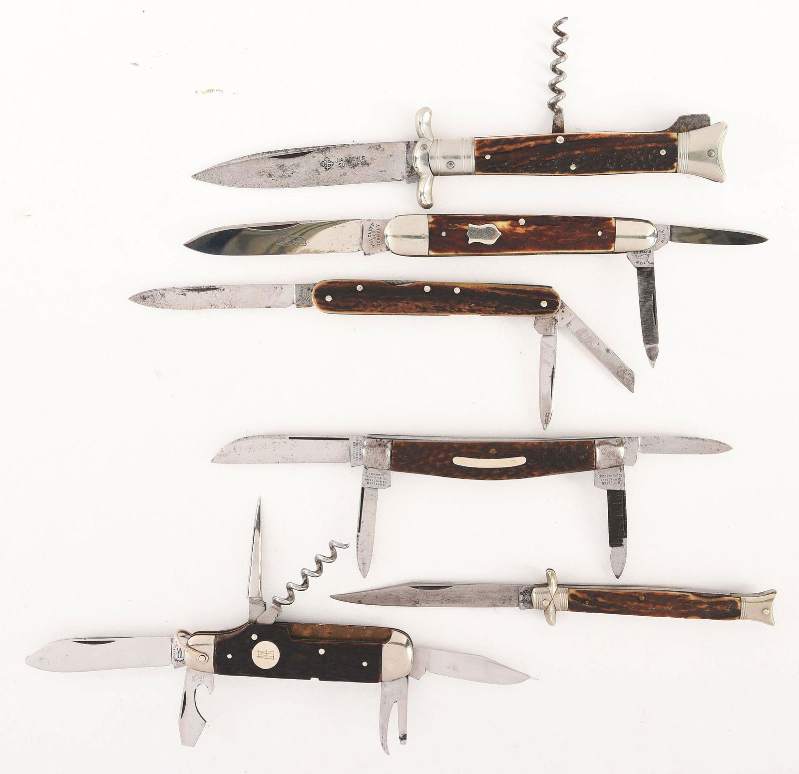 LOT OF 6: LARGE PATTERN GERMAN KNIVES IN 1, 2, 3, 4,: (A) J.A. ROEHLE SOLIGEN. 4 - 1/2" two blade lock back with swing guard. Handled in genuine stag, lock is solid, knife is in excellent condition. (B) VOM CLEFF & CO GERMANY. 4" three blade Anglo Saxon