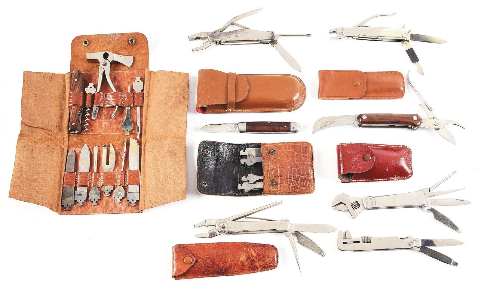 LOT OF 8: 5 WRENCH/PLIARS/SHEARS KNIVES AND 3 TOOL: Three large pliers knives of German and French origin, all in mint condition with correct leather sheaths. One has replaceable tool blades. Two wrench knives, one alligator and one crescent of French