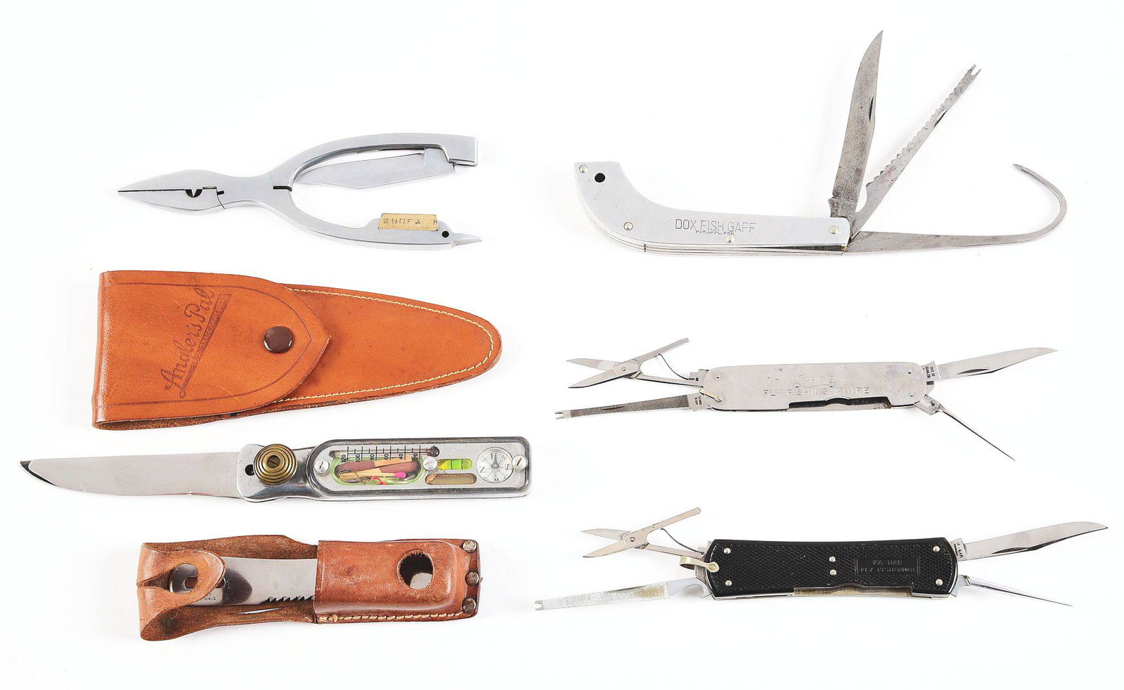 LOT OF 5: 2 AMERICAN FLY TYING KNIVES AND 3 OTHER: (A) 6 - 3/4" Combination pliers/ folding knife with sharpening stone. Blade and sheath are marked "Angler's Pal". Condition is factory mint. (B) 5" Fisherman's field kit containing compass, matches, w