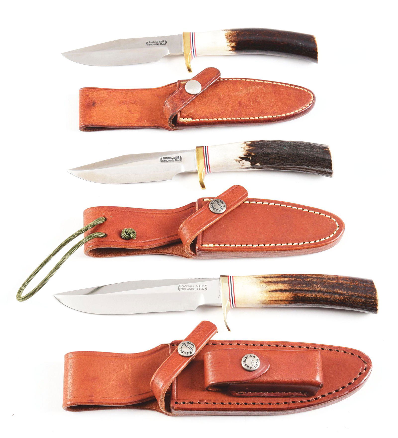 LOT OF 3: RANDALL KNIVES.: (A) Randall Old Style Trout & Bird with 4" carbon blade Brass guard and smooth sambar stag handle in Roughback Randall scabbard. CONDITION: Very good with scabbard showing light soiling. Knife is exce