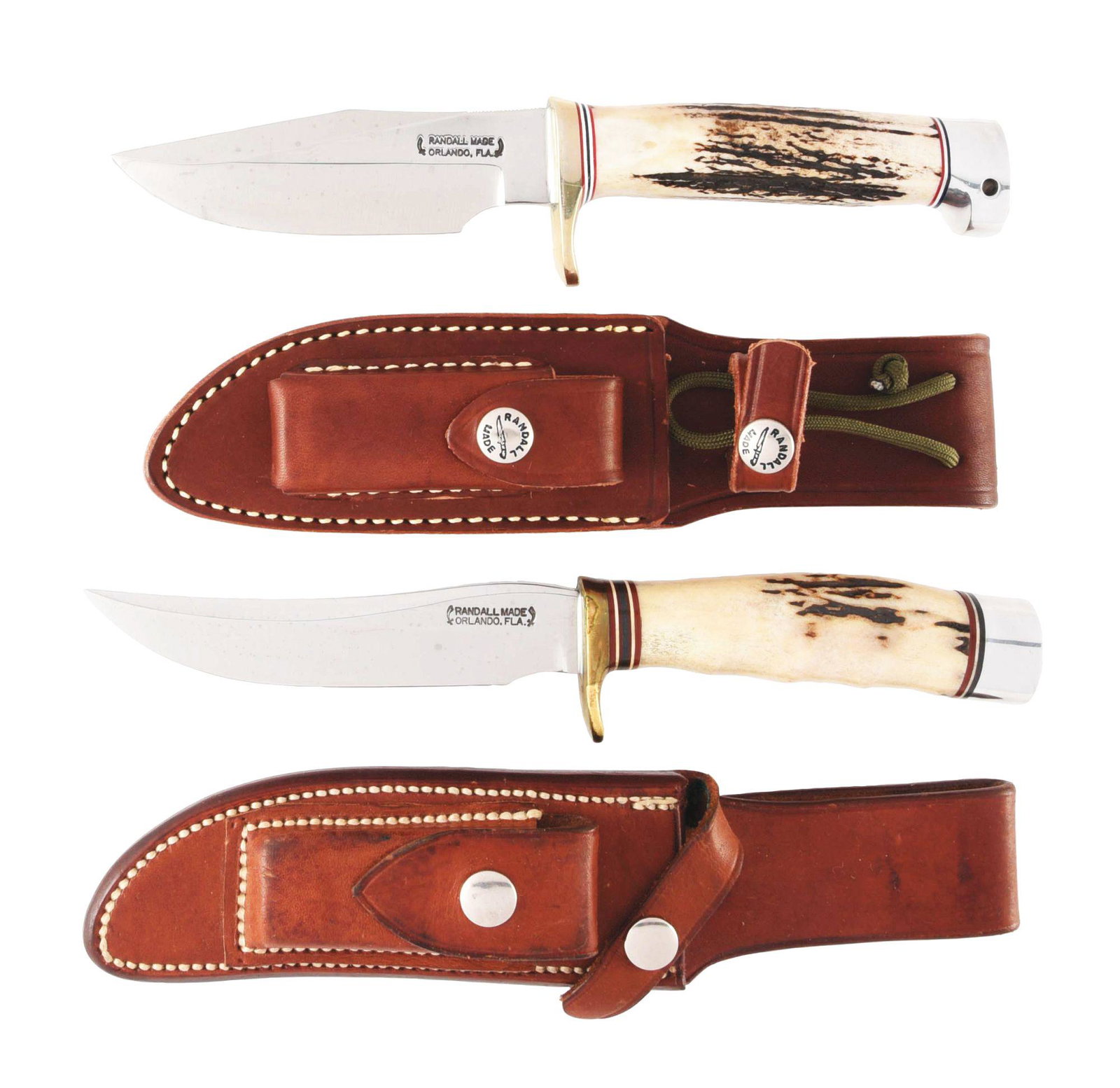 LOT OF 2: RANDALL KNIVES.: (A) RANDELL MADE ORLANDO FLA. Name between 2 swords. 4-1/2" saber ground drop point clip blade. 9" overall. Handled in genuine stag. Heavy brass single guard, aluminum crown. Original factory sheath c