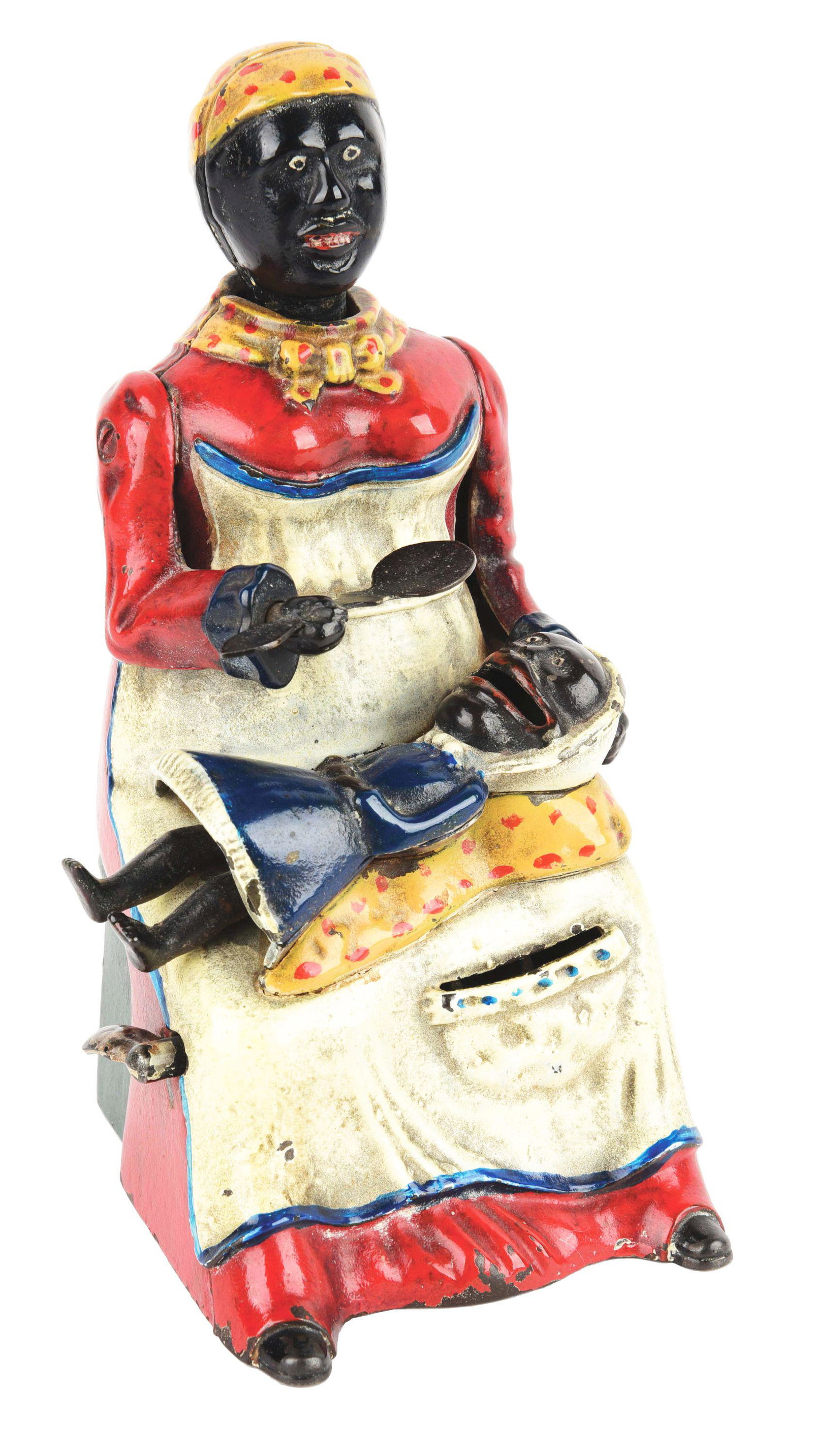 MAMMY BANK.: Kyser & Rex, c. 1884. Professional paint restoration. Missing trap, spoon replaced, baby's legs do not work. Condition: (Excellent). Item Dimensions: 7 - 1/2" x 4 - 1/4" x 4 - 3/4".