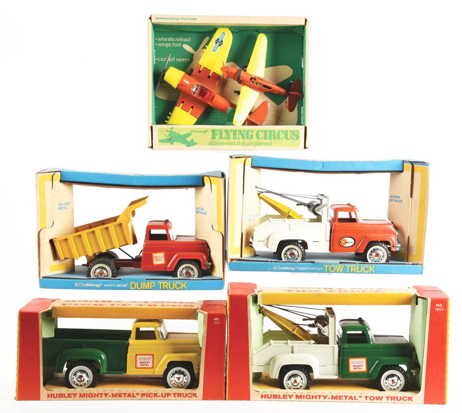 LOT OF 5: HUBLEY DIE-CAST MIGHTY METAL-TYPE: All in original boxes. Post-war. There are two tow trucks, a dump truck, a pickup truck and a flying circus stunt plane set, which consists of two airplanes. All look like old store stock. Some wear t