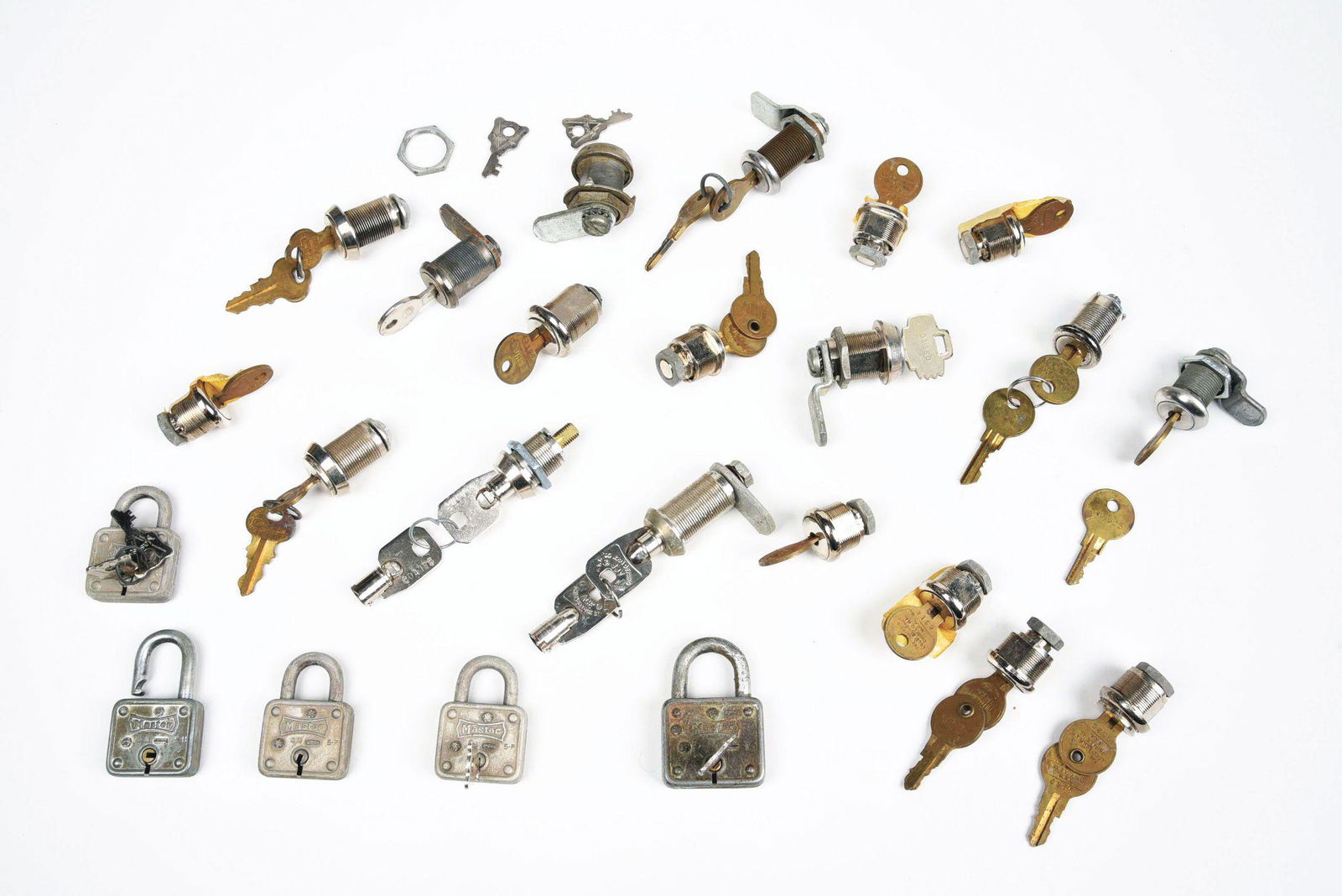 LOT OF COIN-OPERATED MACHINE LOCKS.: This is a lot original coin-operated machine locks consisting of several cam locks in various sizes as well as five original padlocks. Condition: (Good - Very Good). Dimensions: Each: 2" x 2 - 1/2" x
