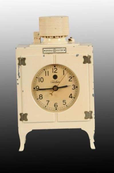 Antique Metal General Electric Clock.: Description Made by Telechron of Massachusetts. Circa 1930s. Electric cord is cut with minor paint loss to clock. Condition (Excellent). Size 8" x 5" x 3".