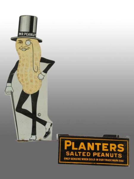 Tin Planters Peanut Mr. Peanut Die-Cut Jar Display: Description 1930s. Tin display is complete and would hold one glass display jar or candy box. Minor wear to display and colors are strong and shiny with no rust apparent. One of three examples known.