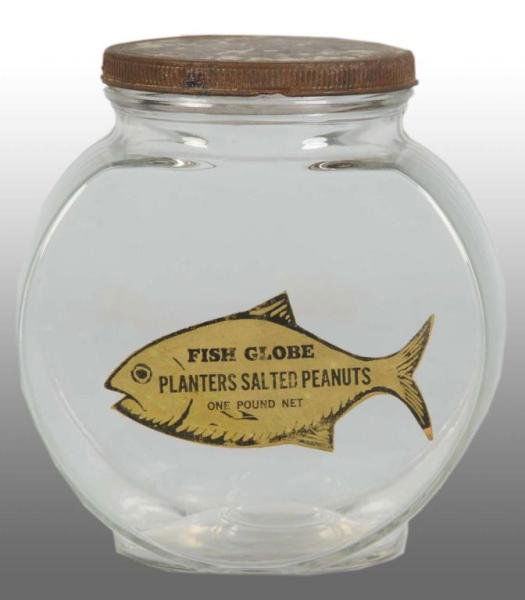 Planters Peanut Mr. Peanut 1lb. Goldfish Jar.: Description Circa 1940s. Jar has original goldfish label. Label is complete and strong. Gold lid is worn but retains original square label inside top of lid. No chips or cracks. Condition (Near Mint).