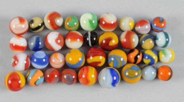 Assortment of Akro Agate Machine-Made Marbles.: Description Not all pictured. Condition (Near Mint Plus). Size Largest: 7/8" Dia.