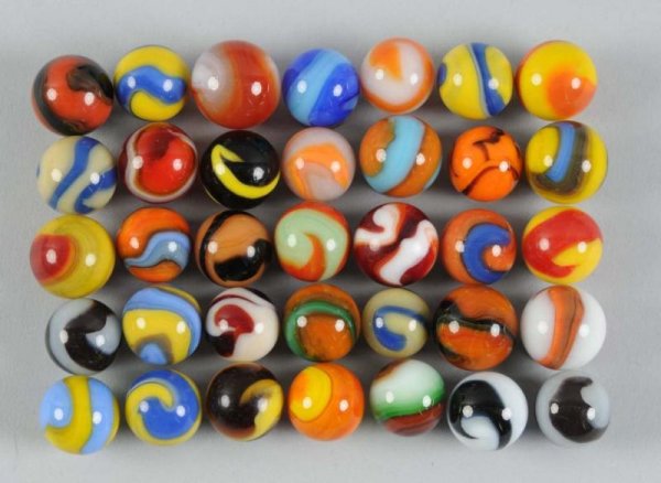 Assortment of Machine-Made Marbles.: Description Includes approximately 72 marbles, most of which are made by Akro Agate Company. Not all pictured. Size Largest: 3/4" Dia.