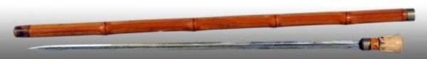Bamboo Gadget Cane Walking Stick.: Description Dated "1877". Concealed sword. Condition (Excellent). Size 35" L.