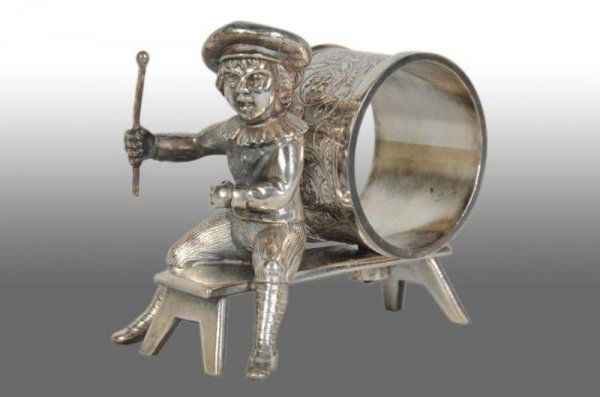 Kate Greenaway Boy on Bench Figural Napkin Ring.: Description Marked "Hartford Silver Co." and numbered "030". Boy sitting on bench with stick in hand in front of napkin holder. Condition (Excellent).