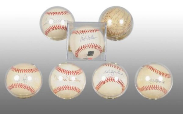 Lot of 7: Autographed Baseballs.: Description Six are single signature balls and one is a 1960s New York Mets team ball. Single signed balls are Ted Williams on a Bobby Brown American League ball, two Whitey Ford, Nolan Ryan, Duke Sny