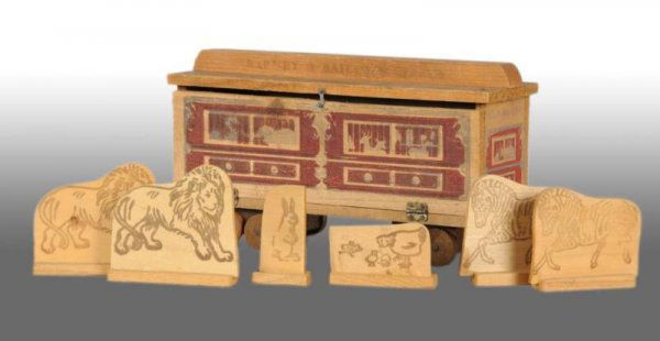 Wooden Barney & Bailum's Circus Menagerie Toy.: Description American. Circa 1930s. Unusual piece. Includes six carved and printed wooden animals consisting of two zebras, two lions, set of chickens and a rabbit. Door swings open by way of latch. Ma