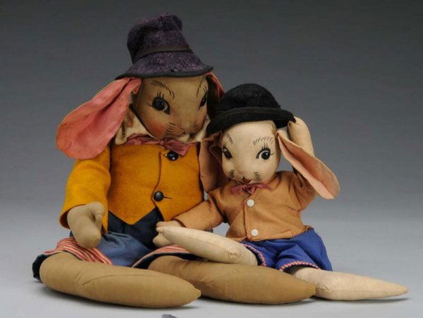 Lot of 2: Uncle Wiggly Rabbit Stuffed Doll Toys.: Description Very similar clothing and hats are all original. Jacket and ears are faded on the small of two dolls. Both are unmarked. Scarce. Condition (Very Good). Size Largest: 16" T.