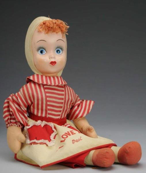 "I Love Lucy" Character Doll.: Description Wearing original apron that says "I Love Lucy" and "Desi" underneath. Made for 1950s hit television show. Includes original clothing, cloth body and thin plastic face. One half-inch and on