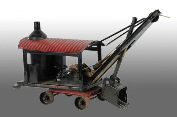 Pressed Steel Buddy L Improved Steam Shovel Toy.: Description Circa 1925. Very hard-to-find model with the extended shovel boom. Very complete with moderate chips to decals. Condition (Very Good). Size 21" L.