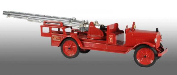 Pressed Steel Buddy L Aerial Ladder Truck Toy.: Description Circa 1934. Front headlights, bumper, six-spoke embossed wheels with rubber tires and single wheels in rear. Complete restoration to an all original toy. Condition (Restored).