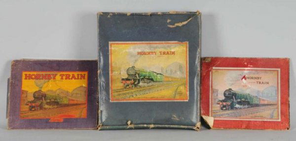 Lot of 3: Hornby Set Boxes.: Description English. Includes very unusual wind-up wide radius track. All three boxes are for o-gauge trains. Moderate overall wear, some water staining, creasing and some tears. Overall good to very