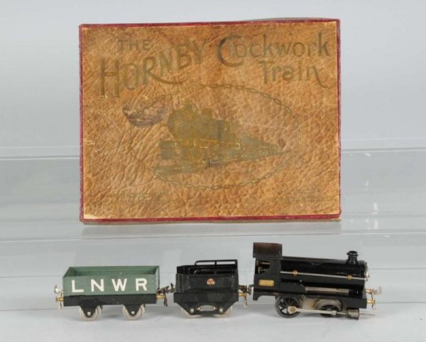 Hornby No. 2710 Clockwork Freight Train.: Description Pre-war. Includes early 2710 set box, two-rail track and beautiful set box. Three-piece set in excellent plus condition. Set box in excellent condition. Pre-war Train