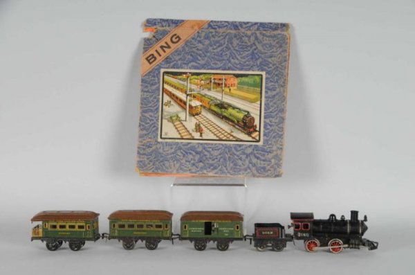 Bing O-Gauge Clockwork Passenger Set.: Description Pre-war. Includes Bing clockwork steam engine, 1012 tender, and three short passenger cars: Rockford, 501 US mail, and Kenosha observation car. Box has a beautiful label on the front, side