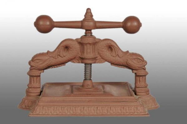 Cast Iron Book Press.: Description Works well. Figural Cast Iron Condition (Excellent). Size 18" x 12" x 14".
