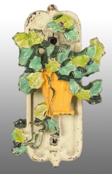 Cast Iron Ivy Flowers in Basket Door Knocker.: Description Made by Hubley, numbered and signed, "123, Made in USA." Bright colors. Figural Cast Iron Condition (Excellent). Size 4 - 1/2" x 2 - 1/2".