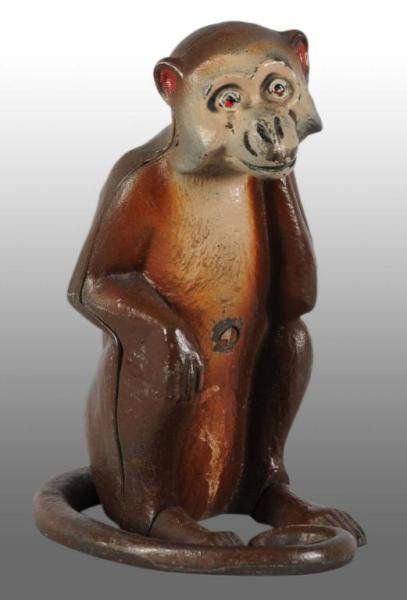 Cast Iron Monkey Doorstop.: Description Made by Hubley. Full-figure. Three piece casting with the tail attached with a screw. Figural Cast Iron Condition (Excellent). Size 8 - 7/8 x 4 - 5/8".