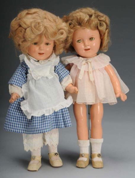 Lot of 2: Ideal Composition Shirley Temple Dolls.: Description American, 1930s. Both embossed "Shirley Temple" on head and body. One has original reset mohair wig, crazed, lashed sleeping eyes, original dress, undergarments, shoes and socks. Crazing o